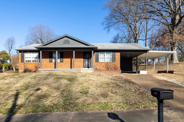 view of front of house with covered porch and a carport