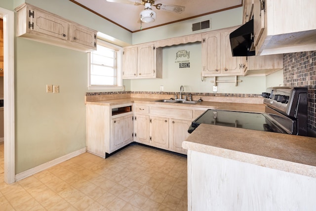 kitchen featuring sink, light brown cabinets, electric stove, and ceiling fan