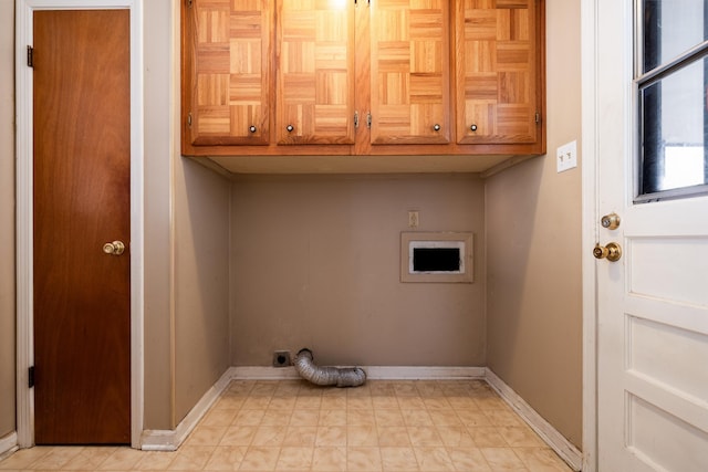 washroom with cabinets and electric dryer hookup