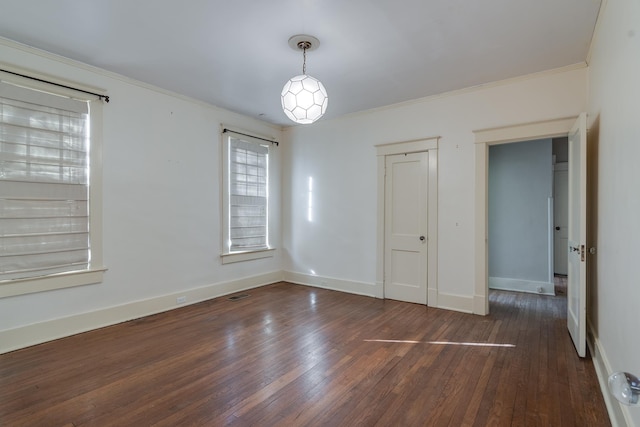 unfurnished bedroom featuring crown molding and dark hardwood / wood-style flooring