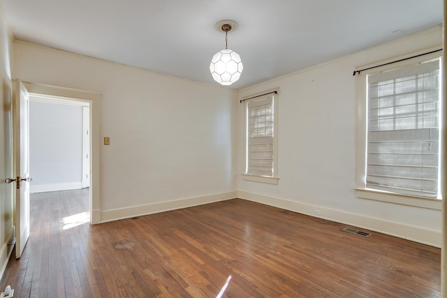 unfurnished room featuring dark hardwood / wood-style flooring