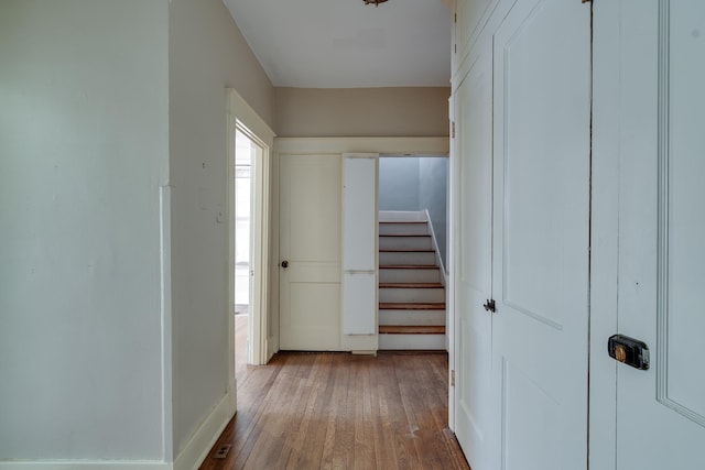 corridor featuring hardwood / wood-style floors