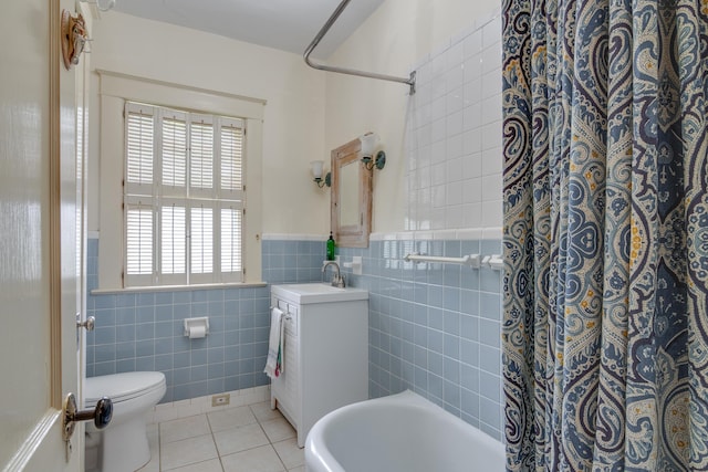 bathroom featuring tile walls, toilet, tile patterned floors, and vanity