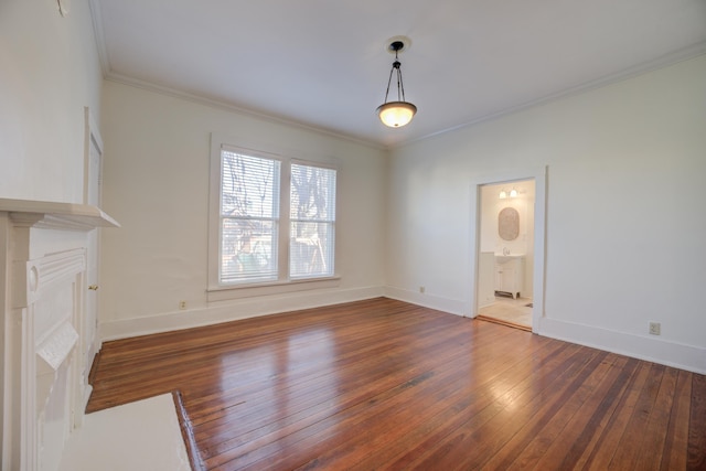 unfurnished living room featuring ornamental molding and dark hardwood / wood-style floors