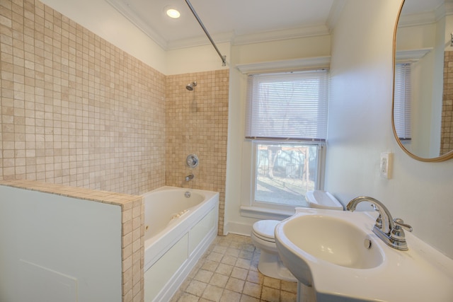 full bathroom featuring sink, tiled shower / bath, ornamental molding, toilet, and tile patterned floors