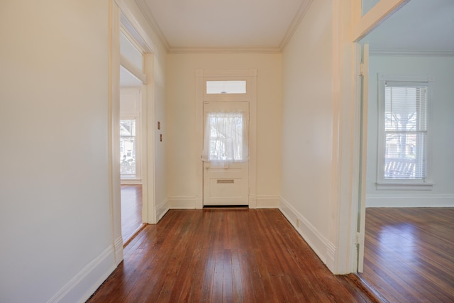 entryway featuring crown molding, a wealth of natural light, and dark hardwood / wood-style floors