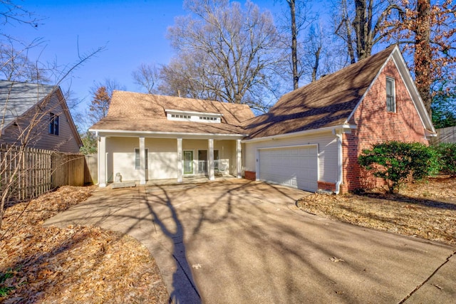 view of front of home with a porch and a garage