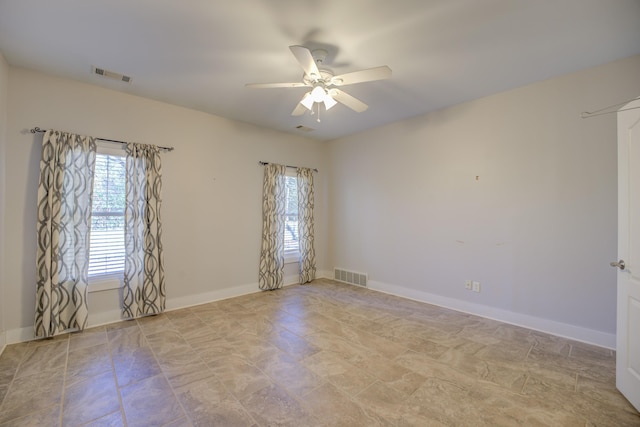 unfurnished room featuring ceiling fan