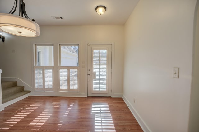 doorway with wood-type flooring