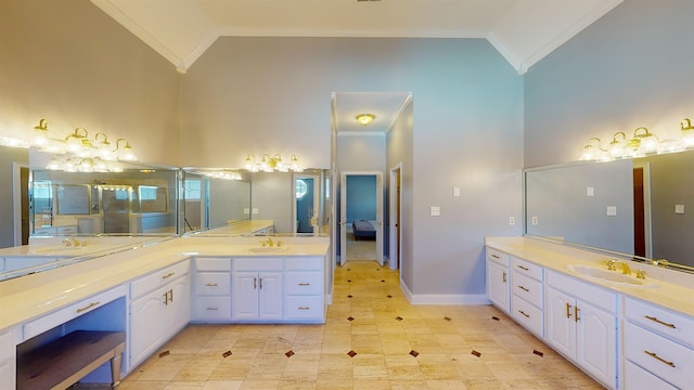 bathroom featuring crown molding, high vaulted ceiling, two vanities, and a sink