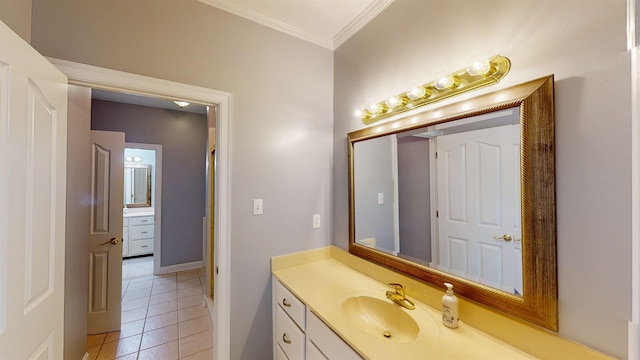 bathroom with crown molding, vanity, and tile patterned floors