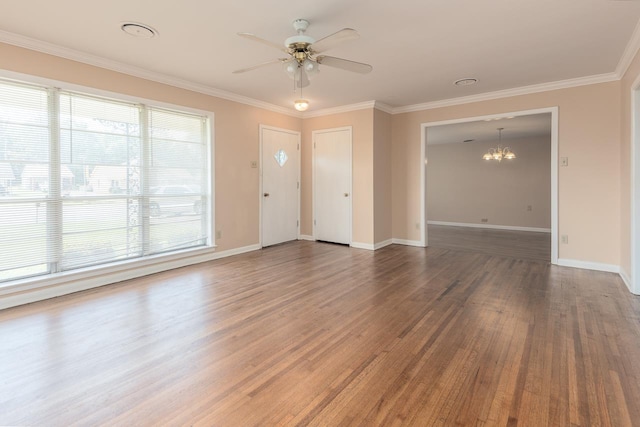 entryway with crown molding, ceiling fan with notable chandelier, and dark hardwood / wood-style floors