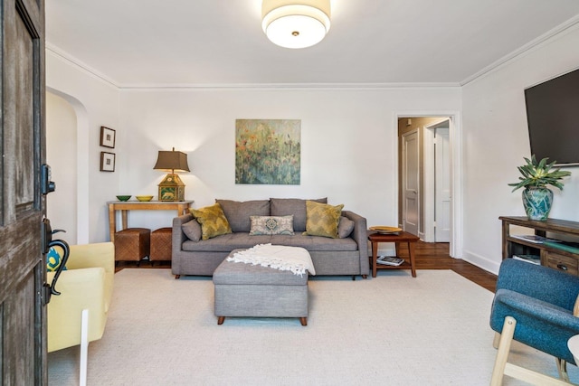 living room with ornamental molding and hardwood / wood-style flooring