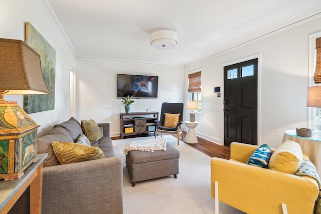 living room featuring crown molding and hardwood / wood-style flooring