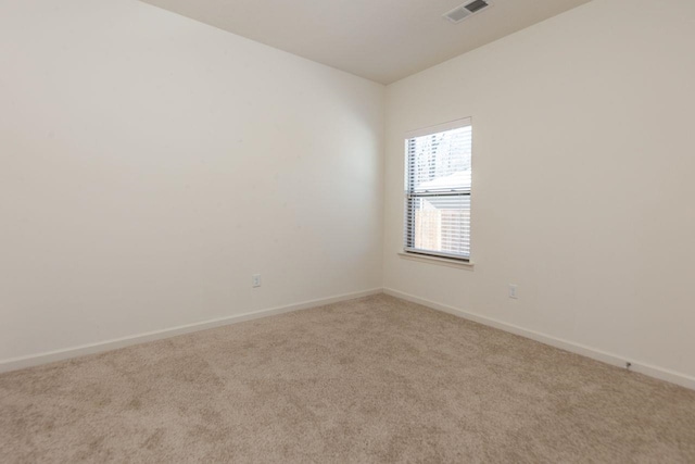 empty room featuring light carpet