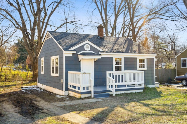 bungalow featuring a front yard