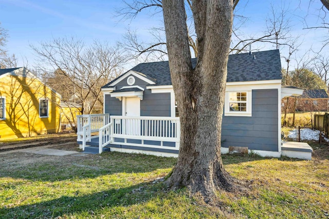 bungalow-style house featuring a front yard