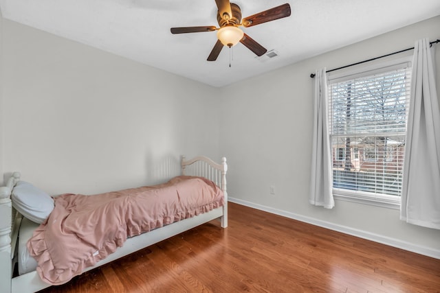 bedroom featuring ceiling fan and hardwood / wood-style floors