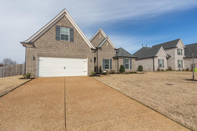 view of front of home featuring a front yard and a garage