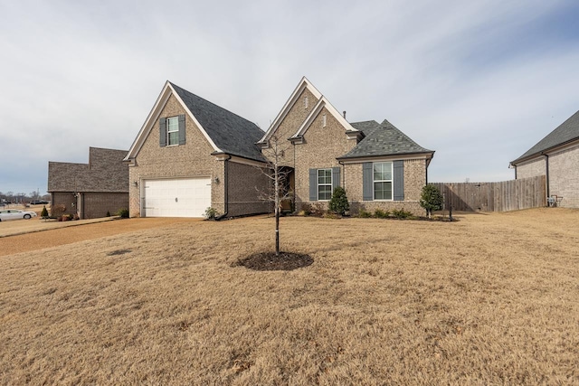 view of front of house featuring a garage and a front yard