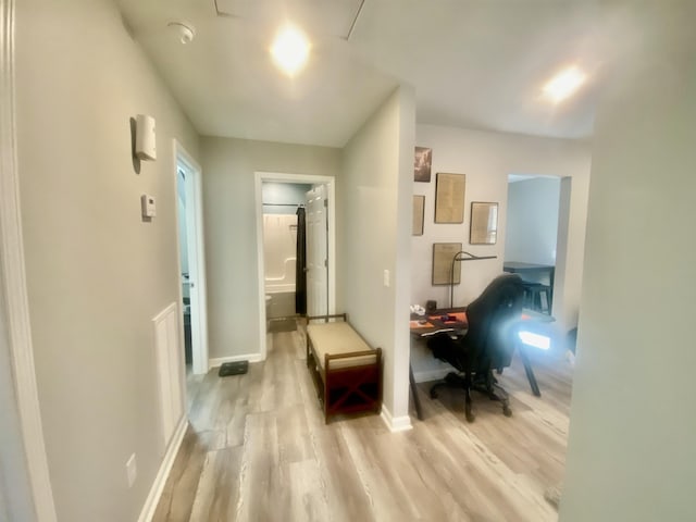 corridor featuring light hardwood / wood-style floors