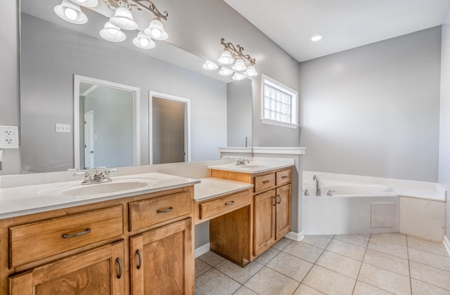 bathroom featuring a washtub, vanity, and tile patterned flooring