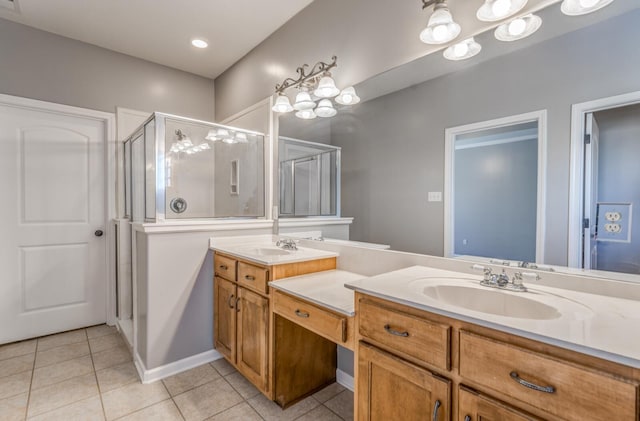 bathroom featuring an enclosed shower, vanity, and tile patterned floors