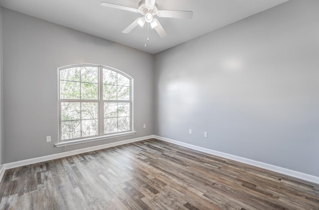 empty room featuring ceiling fan and hardwood / wood-style floors