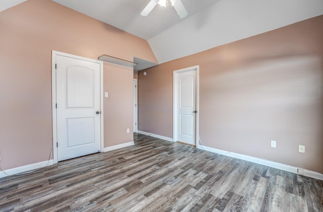 unfurnished bedroom with ceiling fan, wood-type flooring, and vaulted ceiling