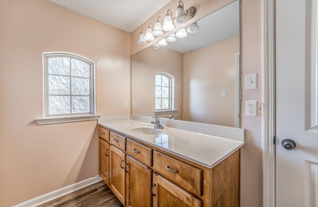 bathroom featuring hardwood / wood-style flooring and vanity