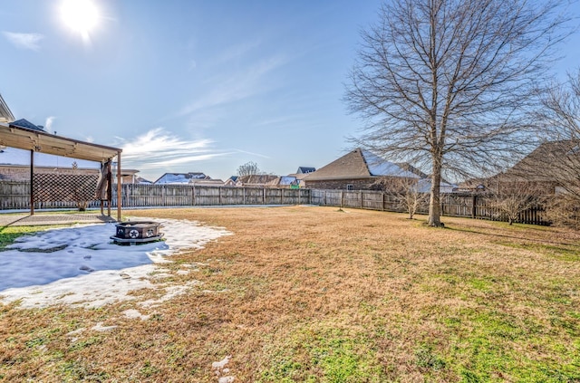 view of yard featuring a patio area and an outdoor fire pit