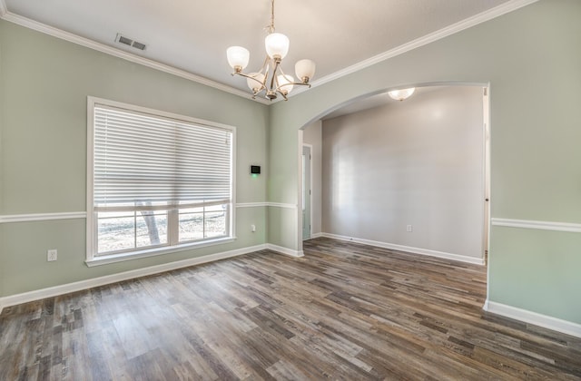 unfurnished room with dark hardwood / wood-style flooring, a chandelier, and ornamental molding