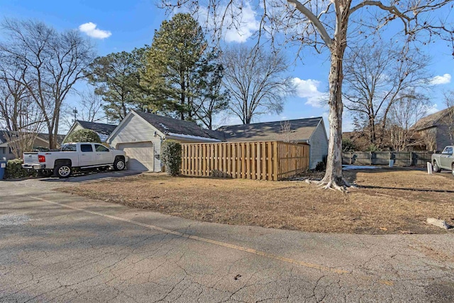 view of side of property featuring a garage