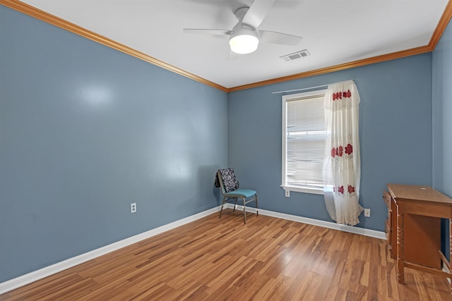 interior space with ceiling fan, wood-type flooring, and crown molding