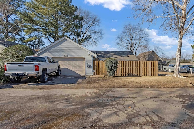 single story home with a garage