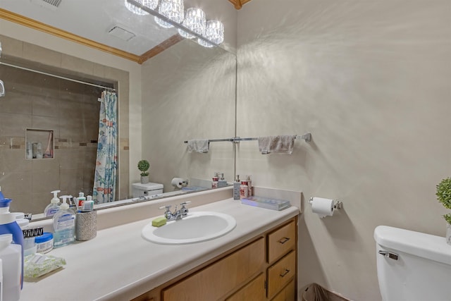 bathroom with toilet, vanity, a shower with curtain, and ornamental molding