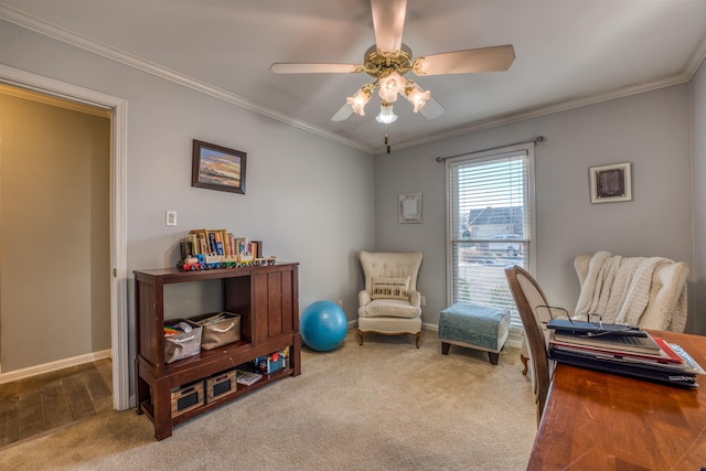 living area featuring ceiling fan, ornamental molding, and carpet flooring