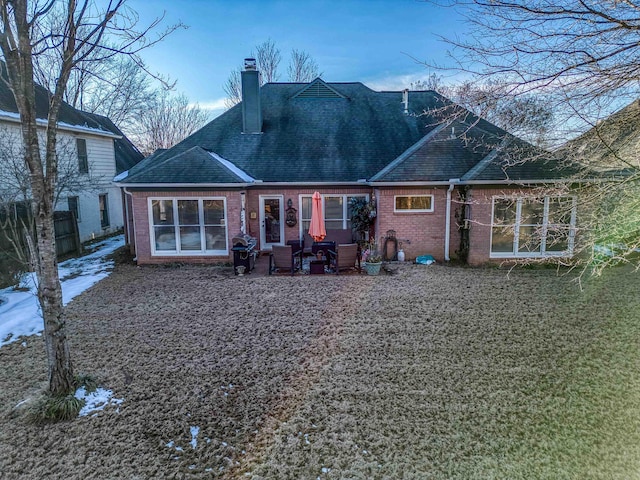 rear view of property with a patio area