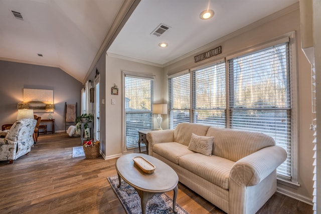 living room featuring vaulted ceiling, dark hardwood / wood-style flooring, and crown molding