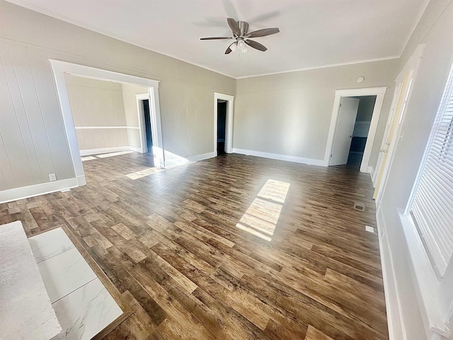 interior space featuring ceiling fan and dark hardwood / wood-style floors