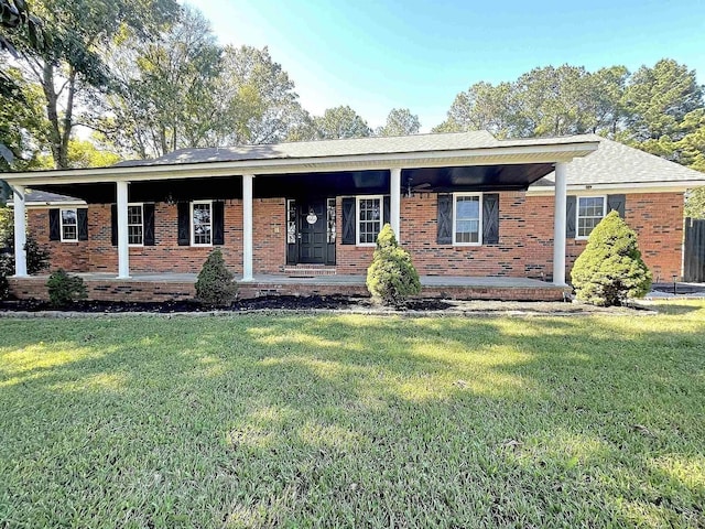 ranch-style house featuring a front yard and a porch