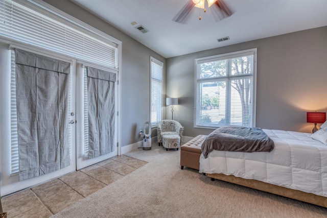 bedroom with ceiling fan and light colored carpet