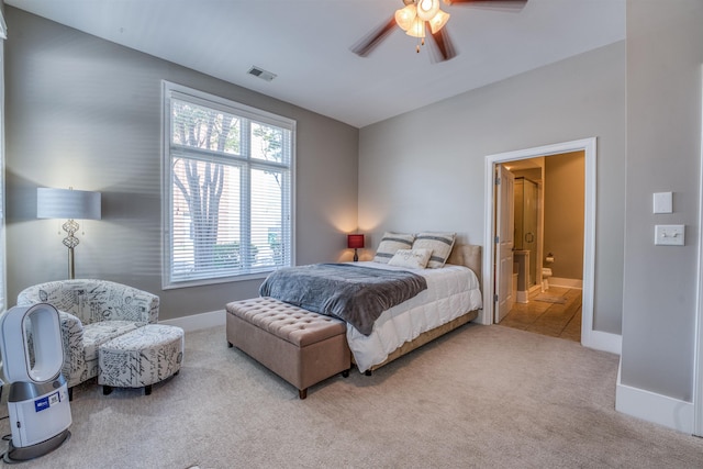 bedroom featuring ceiling fan, connected bathroom, and carpet flooring