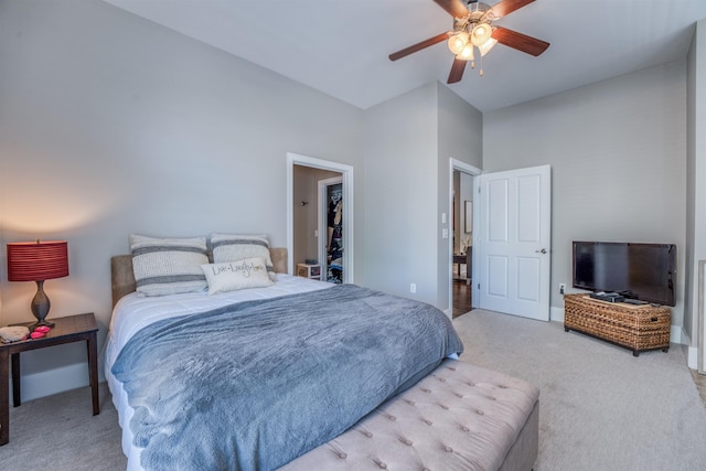 bedroom featuring ceiling fan and light carpet