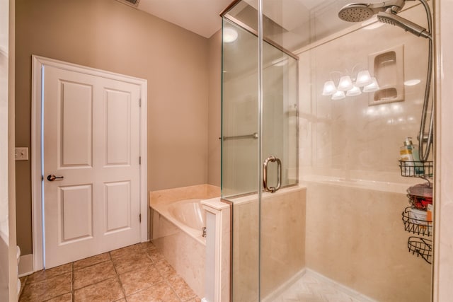 bathroom featuring independent shower and bath