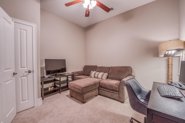 living room featuring ceiling fan and light colored carpet