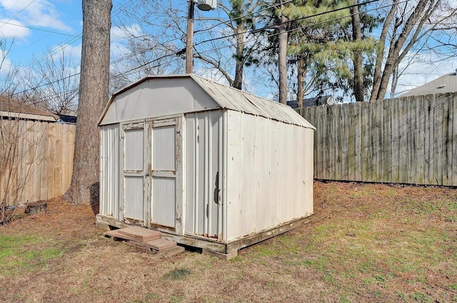 view of outbuilding with a lawn