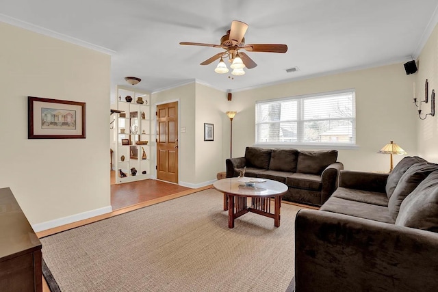 living room with ceiling fan, ornamental molding, and hardwood / wood-style flooring