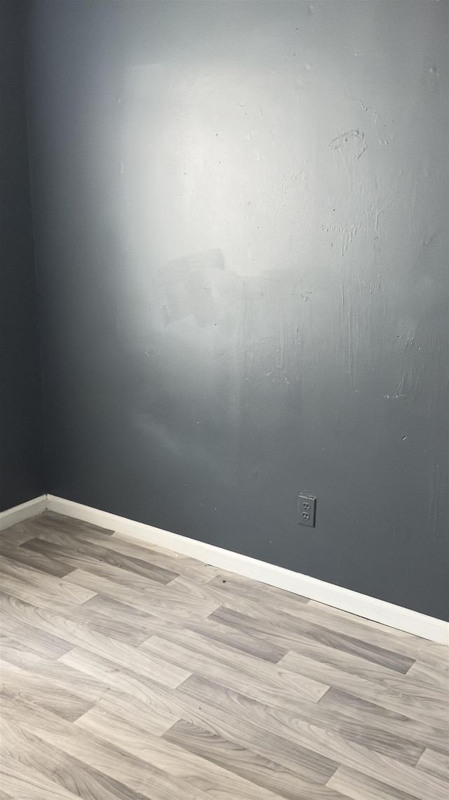 spare room featuring light hardwood / wood-style floors