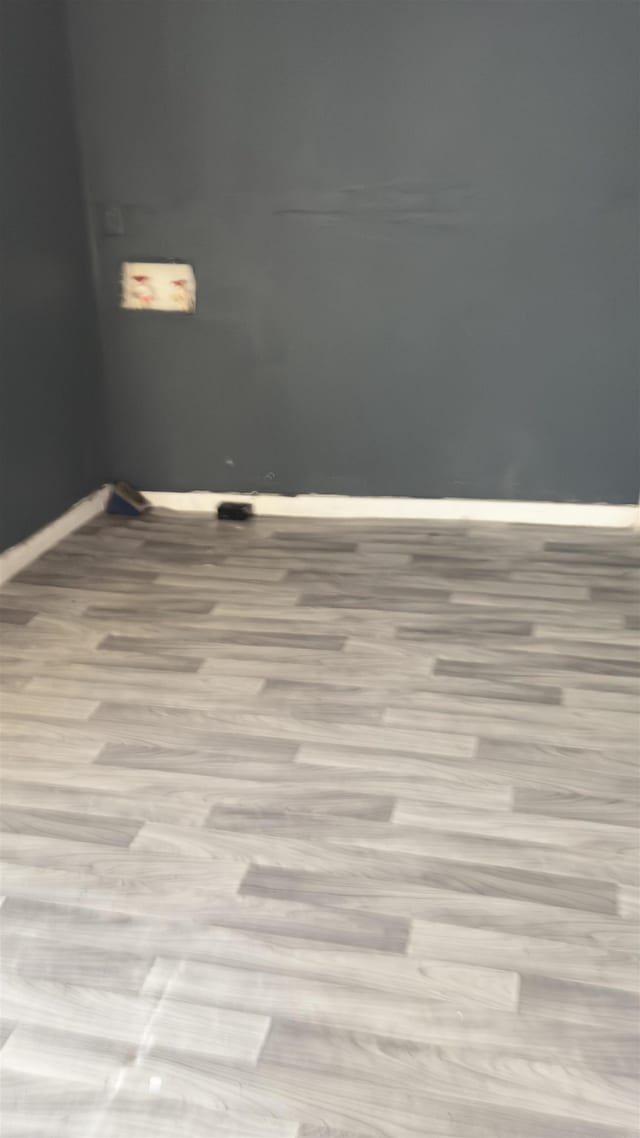 empty room with light hardwood / wood-style floors